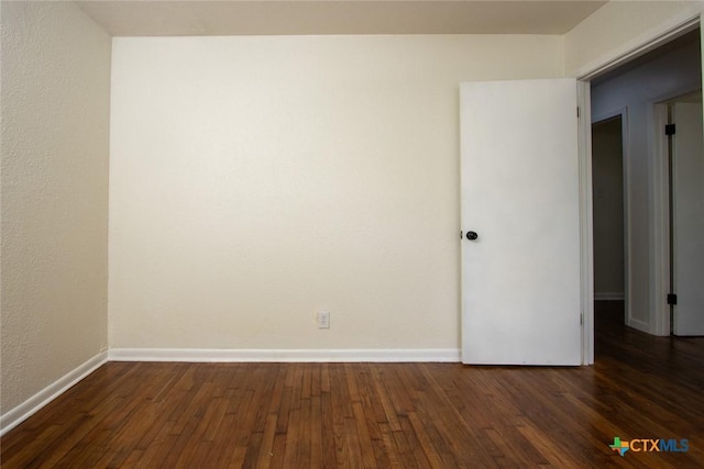 1004 Estes Dr, Killeen, TX 76541 - empty room with dark wood-style floors and baseboards