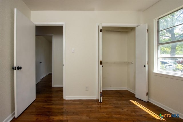 1004 Estes Dr, Killeen, TX 76541 - unfurnished bedroom with wood finished floors, baseboards, and a closet