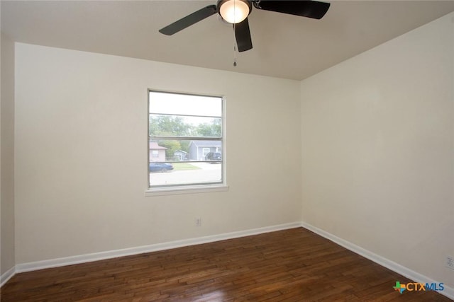 1004 Estes Dr, Killeen, TX 76541 - unfurnished room with dark wood-style floors, ceiling fan, and baseboards