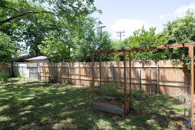 1004 Estes Dr, Killeen, TX 76541 - view of yard with a vegetable garden and a fenced backyard