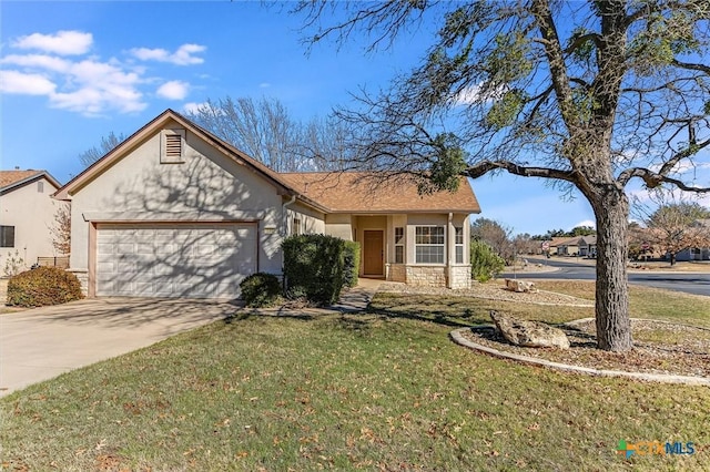 view of front facade featuring a garage and a front lawn