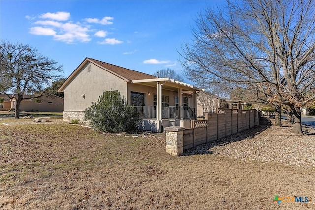 view of property exterior featuring covered porch