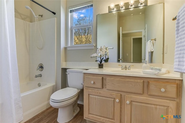 full bathroom featuring shower / bathtub combination with curtain, vanity, toilet, and hardwood / wood-style floors