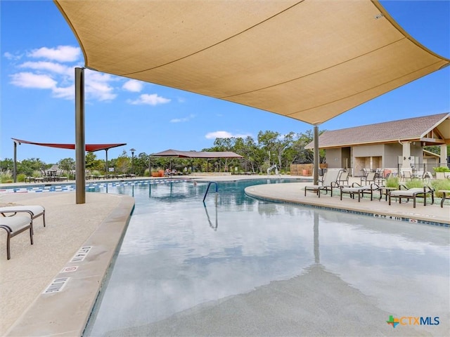 view of swimming pool featuring a patio