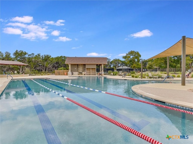 view of swimming pool with a patio area