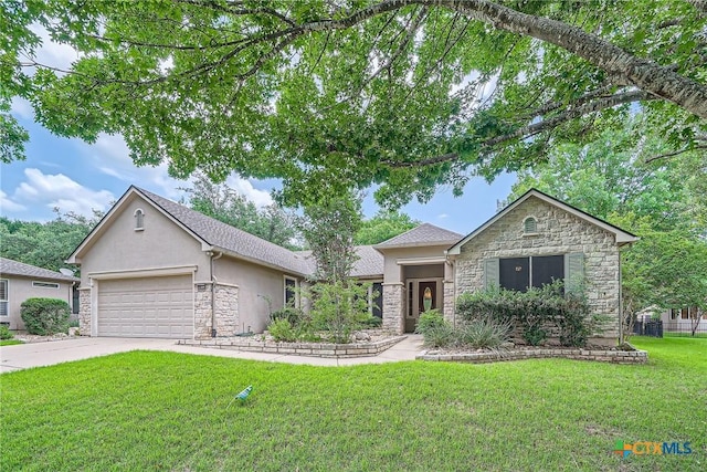 109 Ranch House Cv, Georgetown, TX 78633 - view of front facade with stone siding, stucco siding, and a front lawn