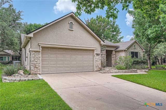 109 Ranch House Cv, Georgetown, TX 78633 - view of front facade featuring stone siding, stucco siding, an attached garage, and a front yard