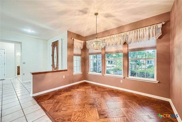 109 Ranch House Cv, Georgetown, TX 78633 - unfurnished dining area with baseboards and a chandelier