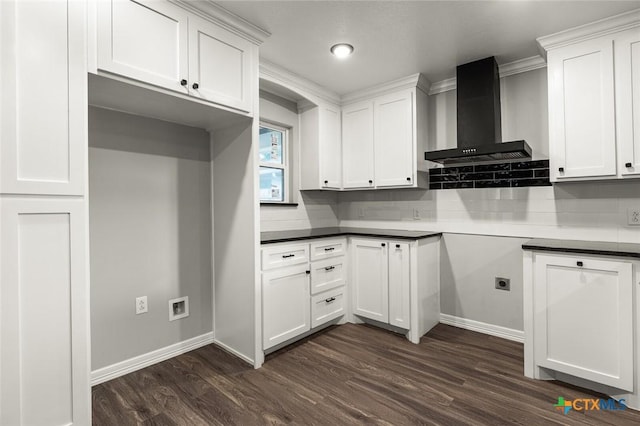 1935 Ross Ave, Waco, TX 76706 - kitchen with wall chimney exhaust hood, dark wood-type flooring, baseboards, and white cabinetry