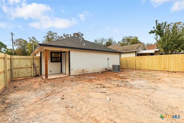 1935 Ross Ave, Waco, TX 76706 - rear view of house with a fenced backyard and central AC unit
