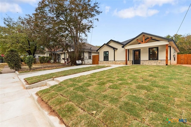1935 Ross Ave, Waco, TX 76706 - modern farmhouse featuring stone siding and a porch