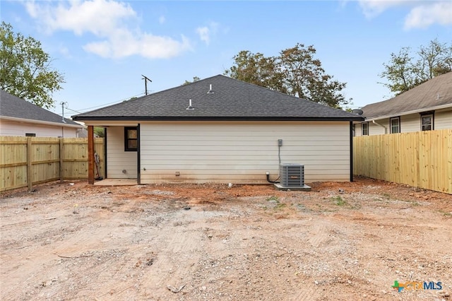 1935 Ross Ave, Waco, TX 76706 - rear view of property with a fenced backyard, roof with shingles, and cooling unit