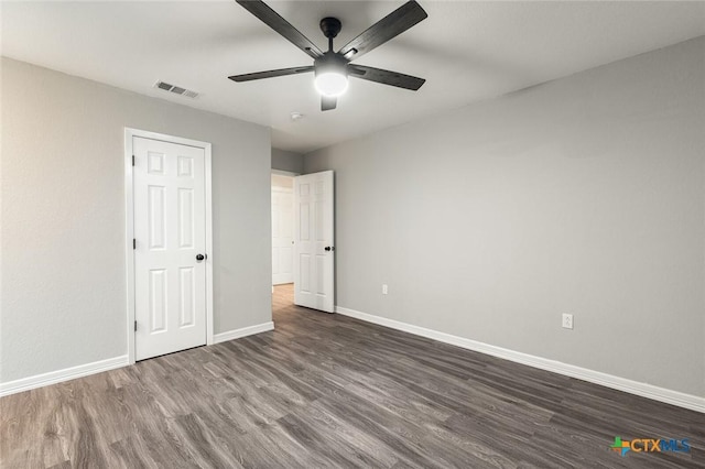 1935 Ross Ave, Waco, TX 76706 - unfurnished bedroom with dark wood finished floors, baseboards, and a ceiling fan