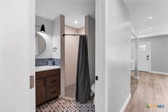 594 E S St, New Braunfels, TX 78130 - bathroom with vanity, tiled shower, and recessed lighting