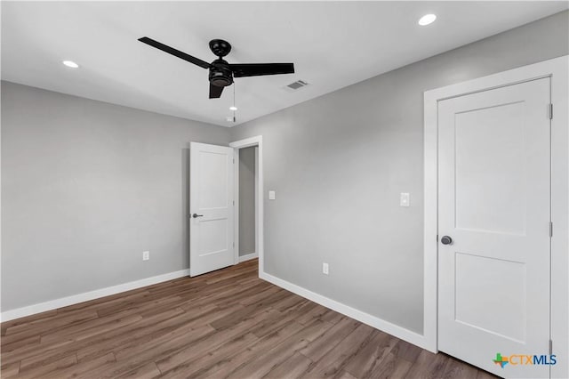 594 E S St, New Braunfels, TX 78130 - unfurnished bedroom with wood finished floors, recessed lighting, and ceiling fan