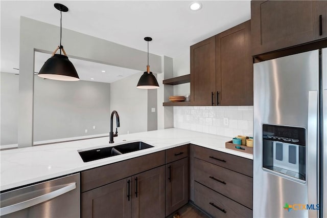 594 E S St, New Braunfels, TX 78130 - kitchen featuring appliances with stainless steel finishes, open shelves, dark brown cabinets, decorative backsplash, and recessed lighting