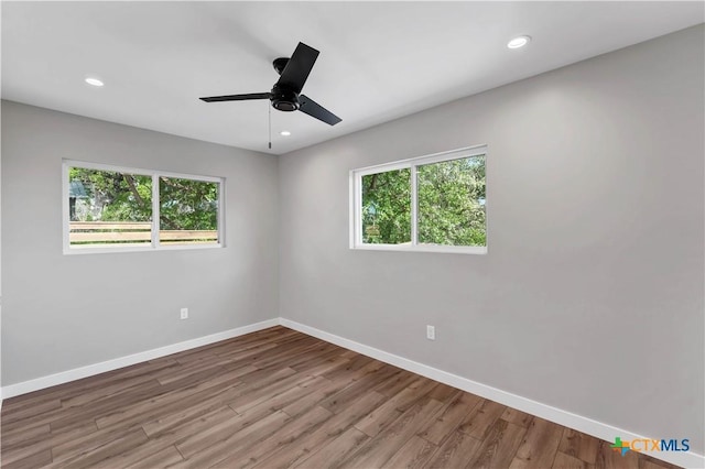 594 E S St, New Braunfels, TX 78130 - spare room with healthy amount of natural light, wood finished floors, recessed lighting, and a ceiling fan
