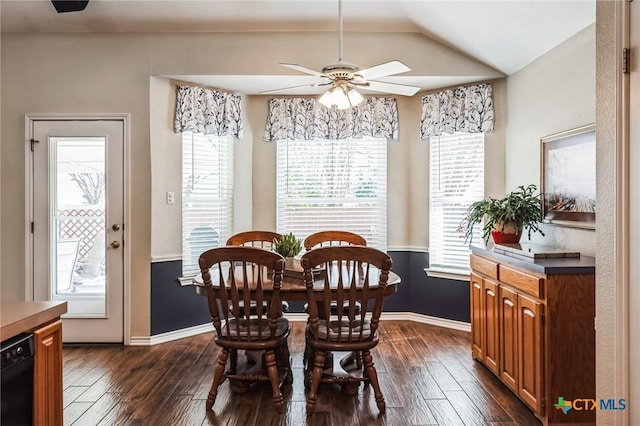 dining space featuring a healthy amount of sunlight, ceiling fan, and dark wood finished floors