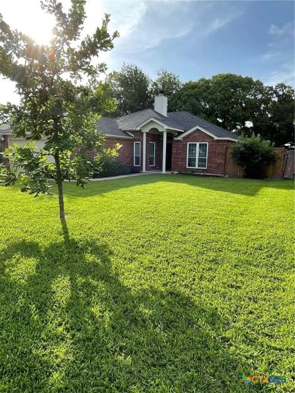 4605 Danbury Dr, Temple, TX 76502 - view of front of house featuring a chimney and brick siding