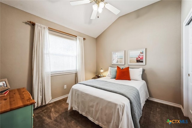 bedroom with lofted ceiling, dark carpet, baseboards, and ceiling fan