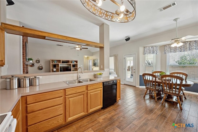 kitchen featuring visible vents, range, dishwasher, wood finished floors, and a sink