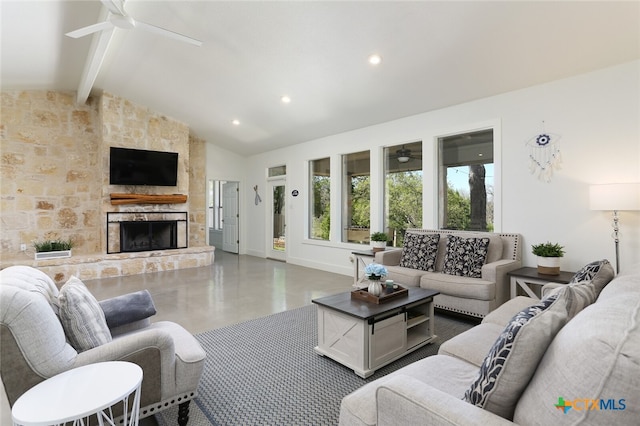 living room featuring beamed ceiling, ceiling fan, a stone fireplace, and high vaulted ceiling