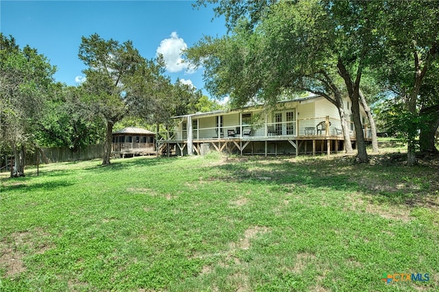 view of yard with a deck