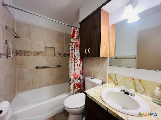 full bathroom featuring backsplash, tile walls, vanity, and shower / tub combo