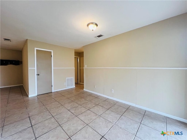 unfurnished room with light tile patterned floors