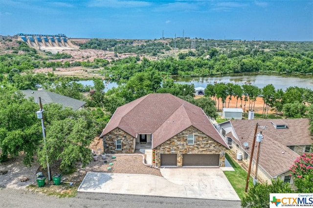 birds eye view of property featuring a water view