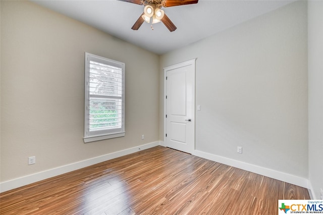 spare room featuring ceiling fan and light wood-type flooring