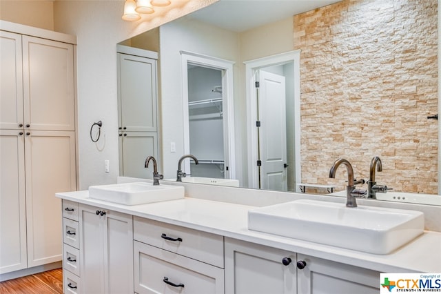 bathroom with hardwood / wood-style floors and vanity