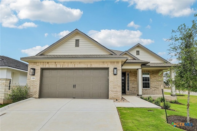 1516 Dancing Oak Ln, San Marcos, TX 78666 - view of front of house featuring brick siding, concrete driveway, a garage, a front lawn, and roof with shingles