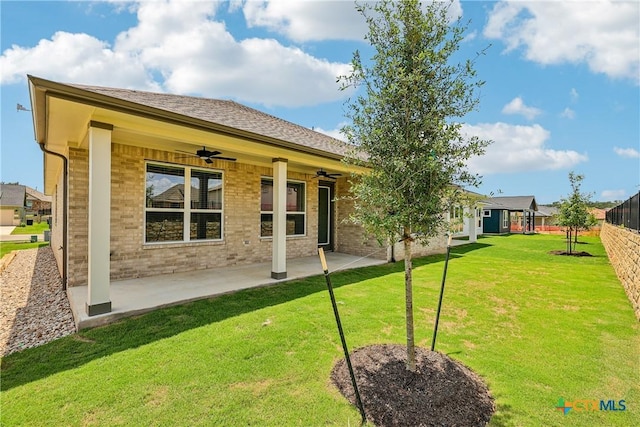 1516 Dancing Oak Ln, San Marcos, TX 78666 - rear view of property featuring ceiling fan, a patio area, and brick siding