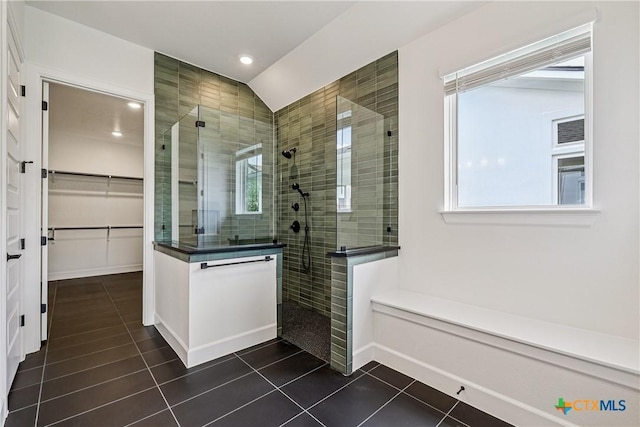 1516 Dancing Oak Ln, San Marcos, TX 78666 - full bathroom featuring tile patterned flooring, a walk in shower, a walk in closet, recessed lighting, and lofted ceiling
