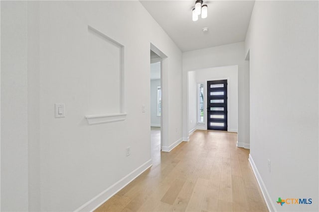1516 Dancing Oak Ln, San Marcos, TX 78666 - hall with light wood-type flooring and baseboards