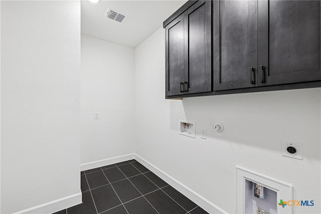 1516 Dancing Oak Ln, San Marcos, TX 78666 - laundry room with cabinet space, electric dryer hookup, gas dryer hookup, hookup for a washing machine, and baseboards