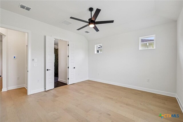 1516 Dancing Oak Ln, San Marcos, TX 78666 - unfurnished bedroom with light wood finished floors, baseboards, and a ceiling fan