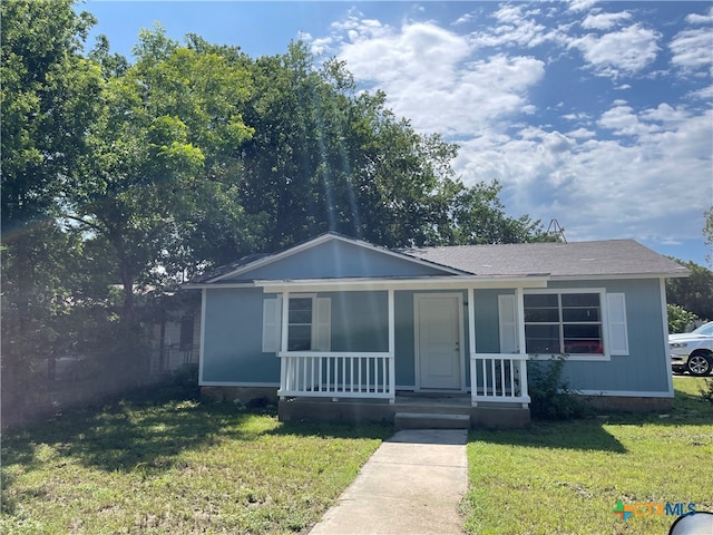 view of front of home with a porch and a front lawn