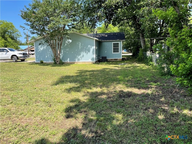 view of yard featuring central AC unit