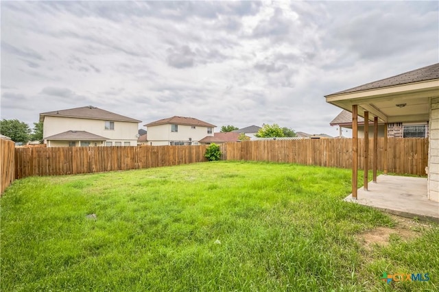 view of yard with a patio and a fenced backyard