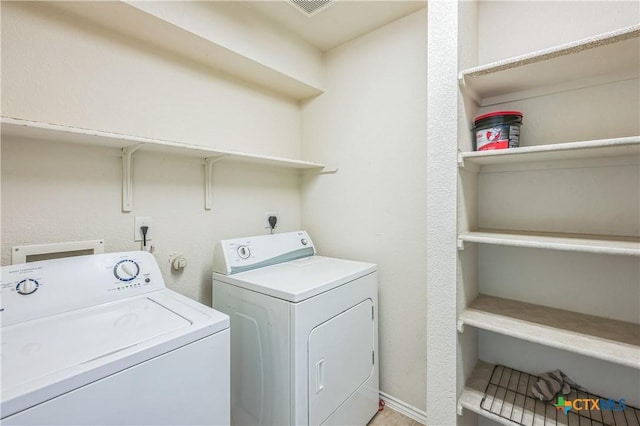 laundry room featuring laundry area, visible vents, and washer and clothes dryer
