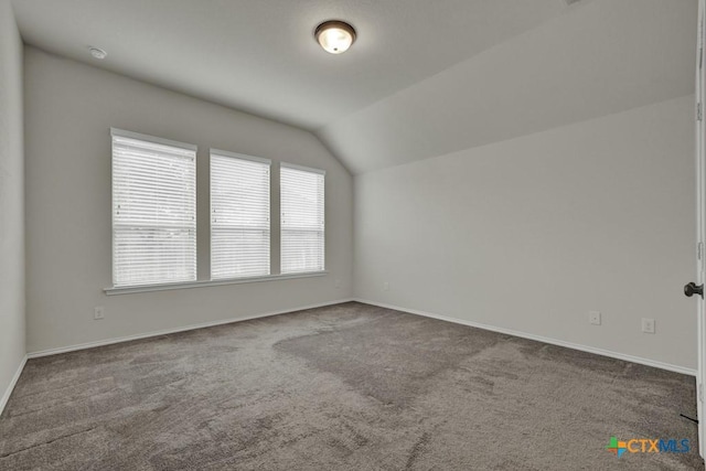 bonus room featuring lofted ceiling and carpet floors