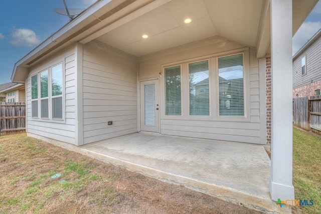 doorway to property with a patio area