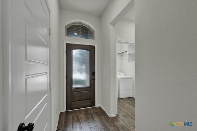 entrance foyer with washer / clothes dryer and dark hardwood / wood-style floors