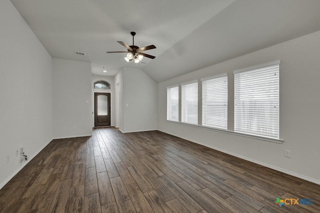 unfurnished room featuring ceiling fan, lofted ceiling, and dark hardwood / wood-style flooring