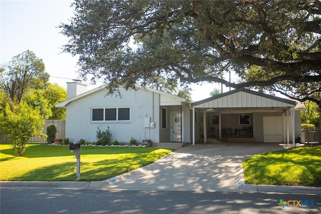 ranch-style home with a front lawn and a carport