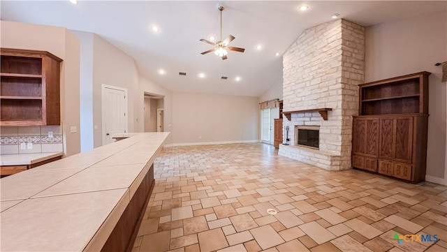 unfurnished living room with ceiling fan, a fireplace, recessed lighting, baseboards, and visible vents