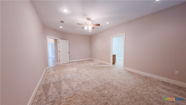 spare room featuring visible vents, baseboards, ceiling fan, recessed lighting, and light colored carpet