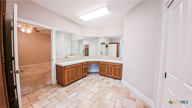 full bath featuring vanity, baseboards, and ceiling fan